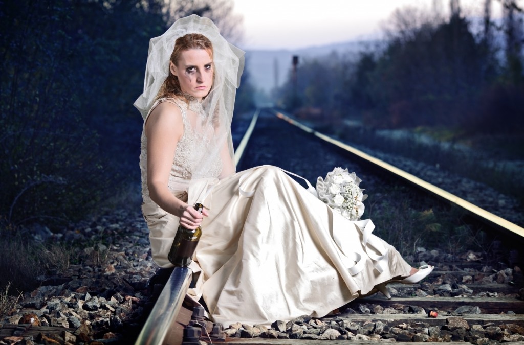 Disappointed bride on a railway